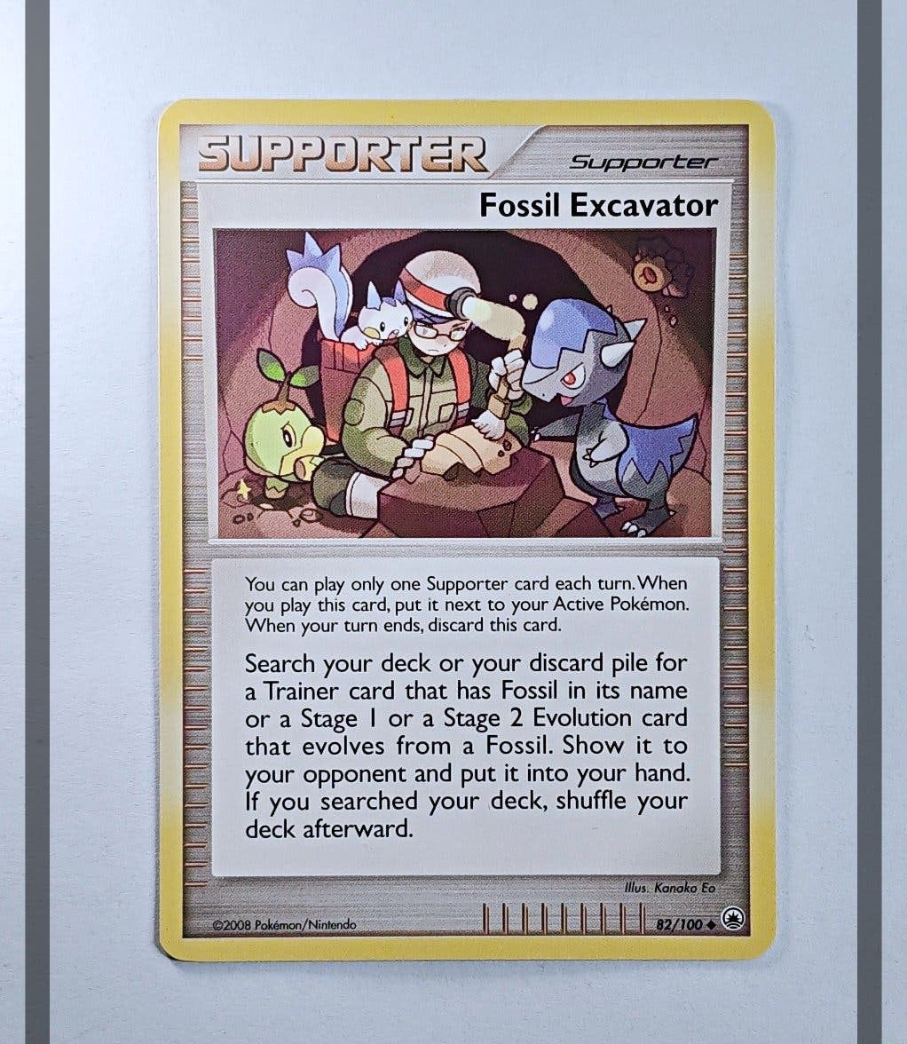 Fossil Excavator 82/100 MD Pokemon ENG-NM